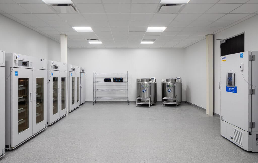 GMP-compliant cell therapy storage room with ultra-low temperature freezers and cryogenic tanks for clinical-grade biologics and cell materials