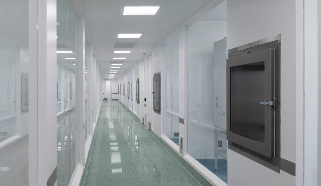 Cleanroom corridor inside Cellipont’s GMP-compliant manufacturing facility, featuring pass-through chambers and controlled access to cell therapy processing suites.