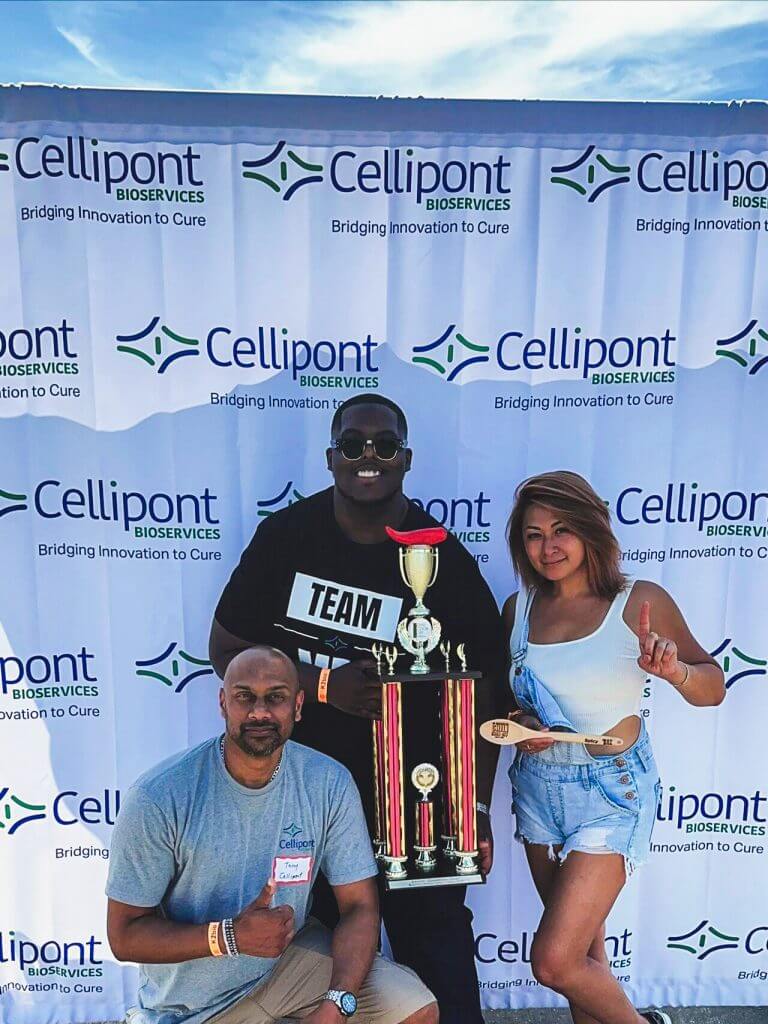 Cellipont Bioservices employees celebrating a team victory at a company event, showcasing team spirit, achievement, and employee engagement.